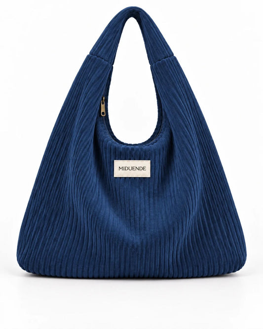 Bolso Hobo en tela de pana azul con cremallera.