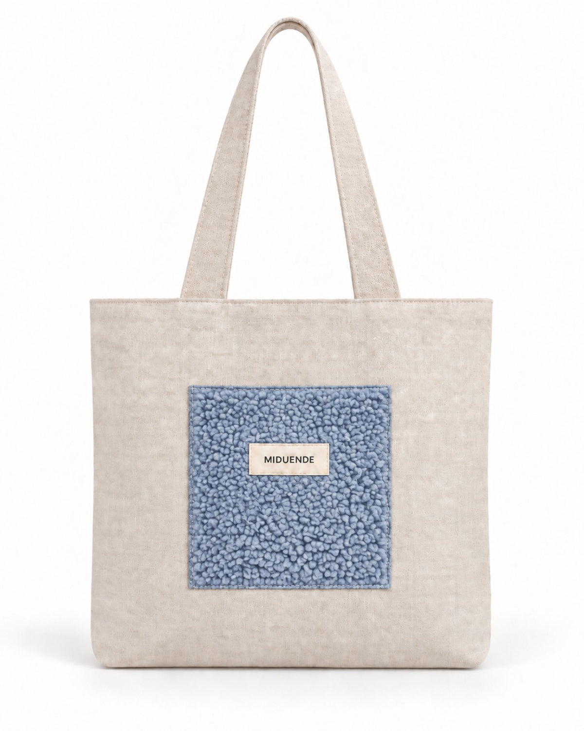 Bolso Tote de lino con bolsillo exterior de borreguito azul. Muy cómodo y práctico.
