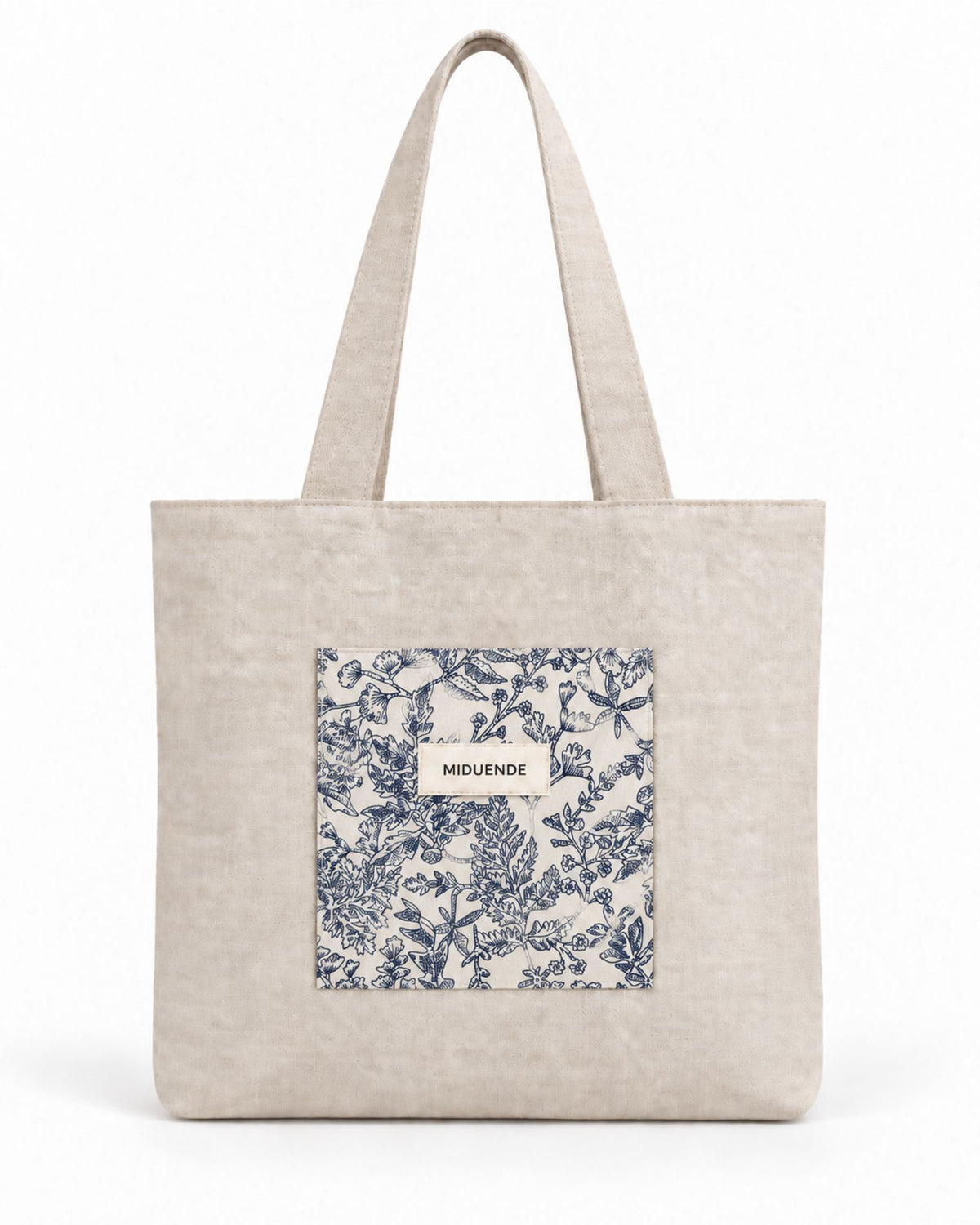bolso totebag de lino con amplio bolsillo exterior acolchada en Jara azul