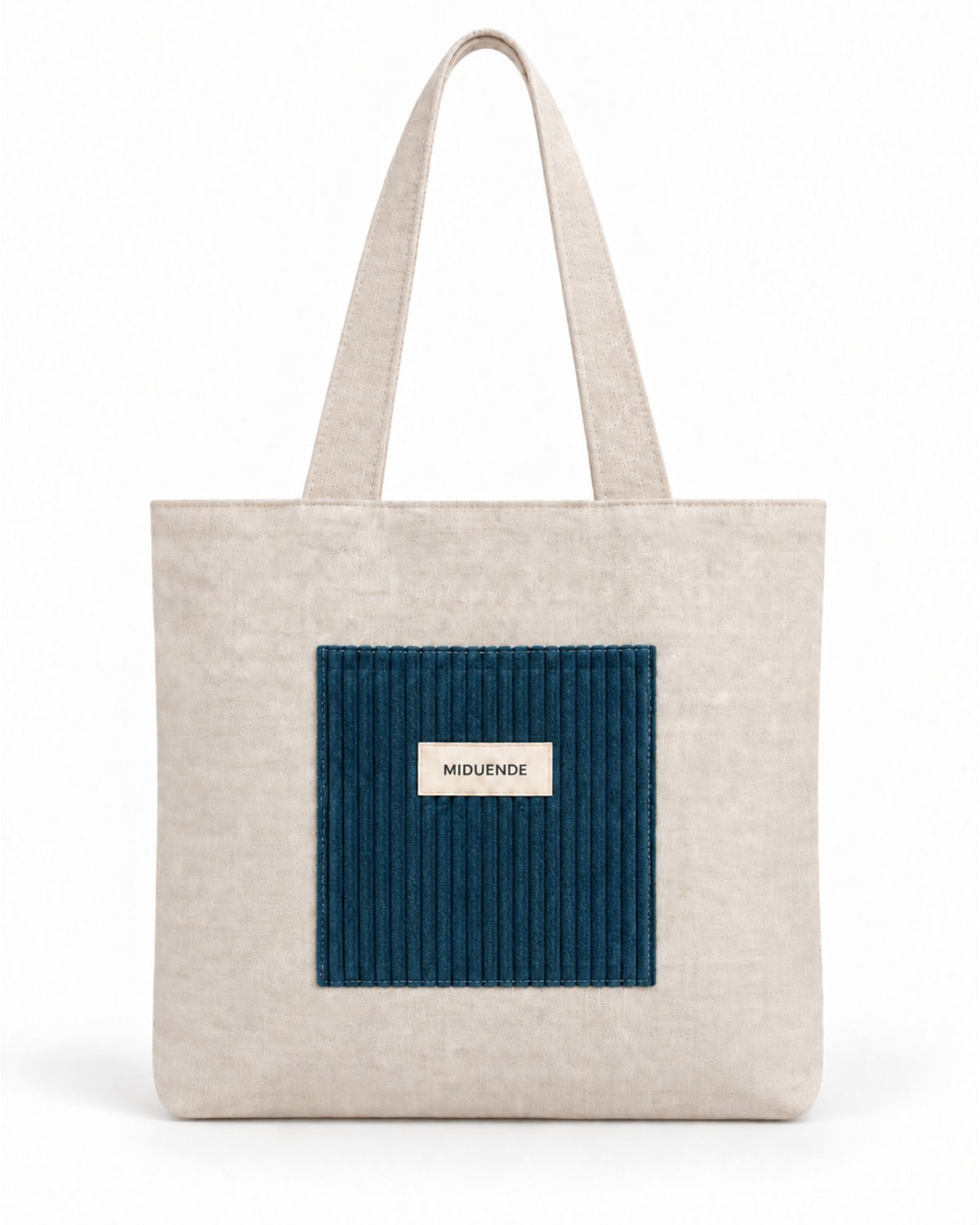 Bolso Tote de lino con bolsilloesterior de pana color azul navy.