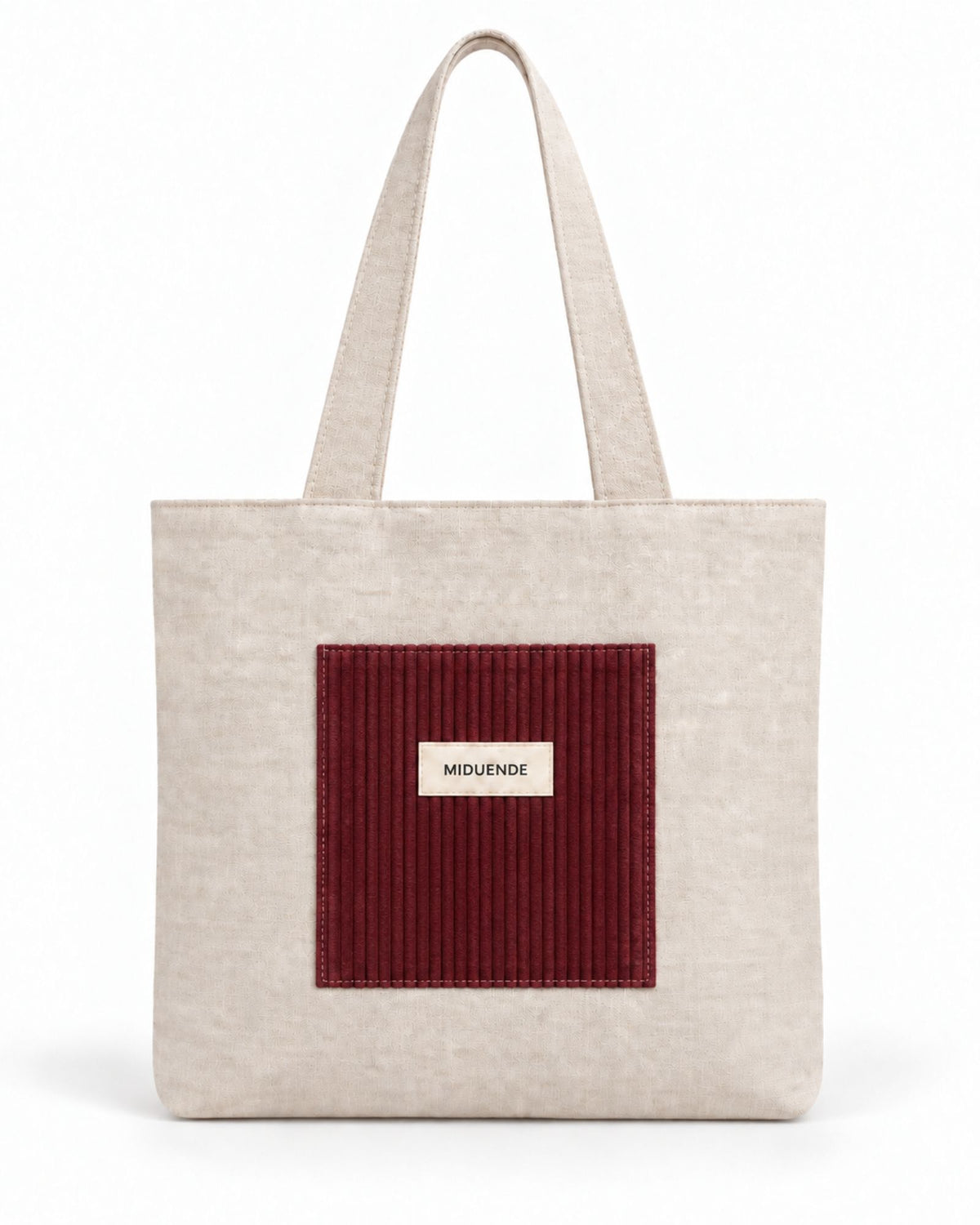 Bolso Tote de lino con bolsilloesterior de pana color vino.